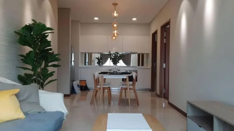 Living features: sofa with cushions, wooden coffee table, pendant lighting, dining table with four chairs, floor-to-ceiling windows, light-colored walls, marble flooring, indoor plant, decorative wall paneling, neutral color palette; style: modern.