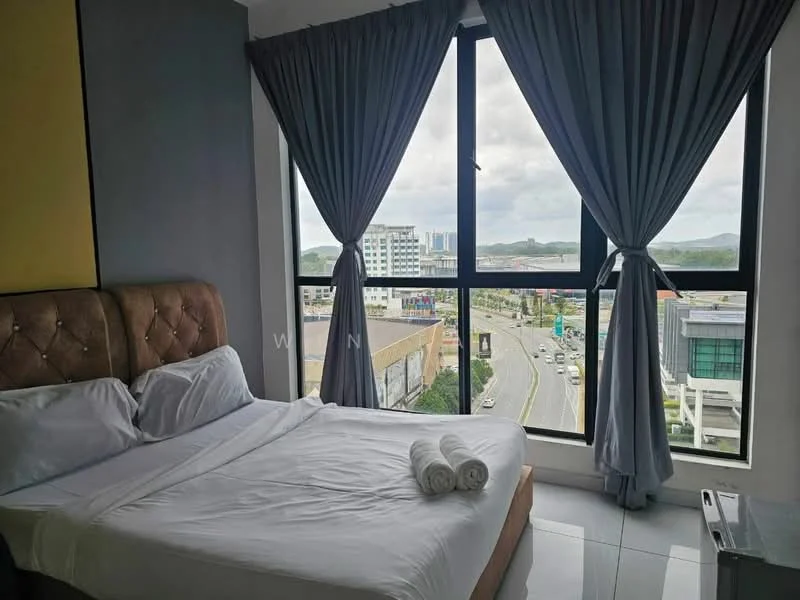 Bedroom features: king-size bed with upholstered headboard, white bedding, two rolled towels on bed, floor-to-ceiling windows, grey curtains, white tiled flooring, decorative wall panel, city view from window; style: modern; view: city.