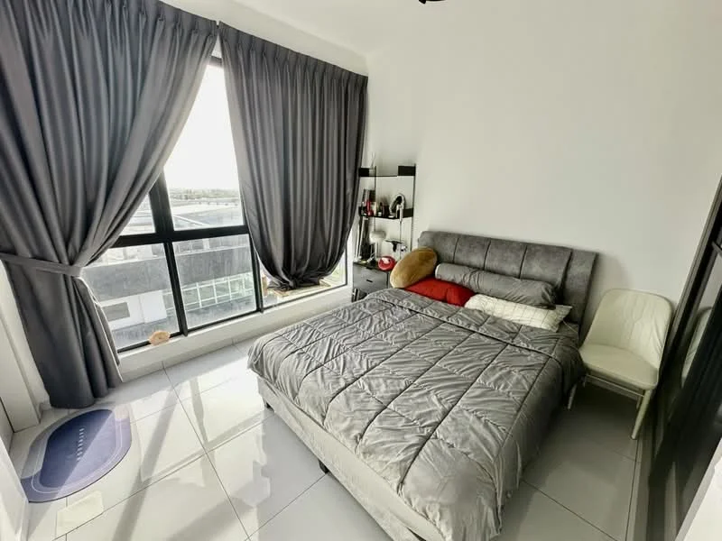 Bedroom features: queen-size bed with grey upholstered headboard, grey bedding, floor-to-ceiling windows, blackout curtains, white chair, decorative pillows in red and beige, white walls, glossy tile flooring, shelf with decorative items; style: modern; view: city.