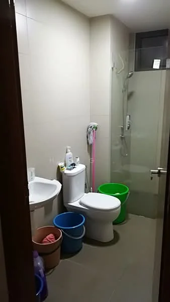 Bathroom features: white tiled walls, grey tiled flooring, walk-in shower with glass enclosure, chrome shower head, one-piece toilet, single-sink vanity, mirror above sink, cleaning supplies in buckets, shower wall-mounted faucet, shower caddy, toilet paper holder; style: modern.