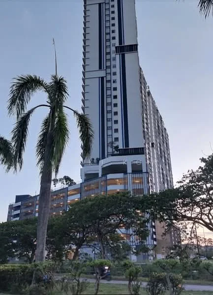 Exterior type: high-rise condominium; features: glass curtain wall, white painted facade, vertical fins, recessed balconies, approximately 30-storey high-rise, surrounded by mature greenery, manicured lawn, palm trees, landscaped garden; style: modern.