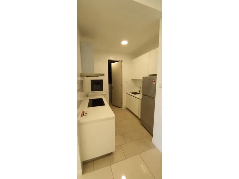 Kitchen features: white cabinetry, granite countertop, built-in oven, freestanding range oven, microwave, stainless-steel fridge, single-bowl stainless-steel sink, chrome pull-down faucet, ceramic tile flooring, recessed downlights, wall-mounted cabinets, open shelving, neutral wall colour, door to laundry area; style: modern.