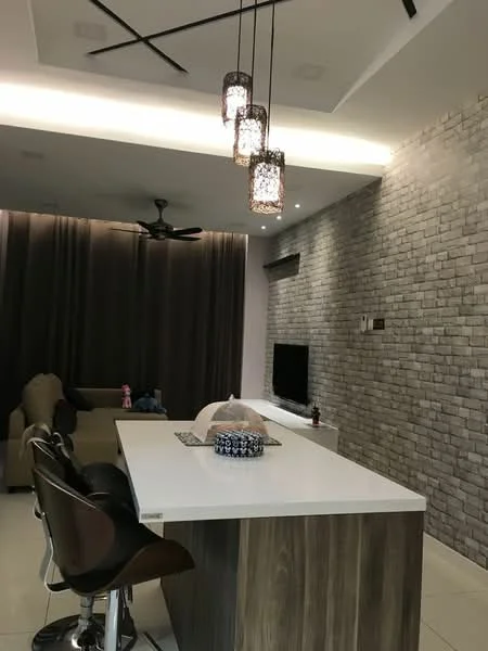 Living features: white quartz countertop, wooden cabinetry, 3-blade ceiling fan, recessed downlights, pendant lighting with decorative shades, grey brick accent wall, cream painted walls, large floor-to-ceiling curtains, wall-mounted TV, beige fabric sofa, bar stools with brown leather seats, decorative items on countertop; style: modern.