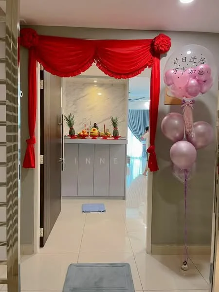 Room features: red fabric drapery, marble wall, decorative altar with offerings, ceramic vases with flowers, light-colored tiled flooring, blue bath mat, balloons in shades of pink, wall-mounted decorative sign; style: modern.