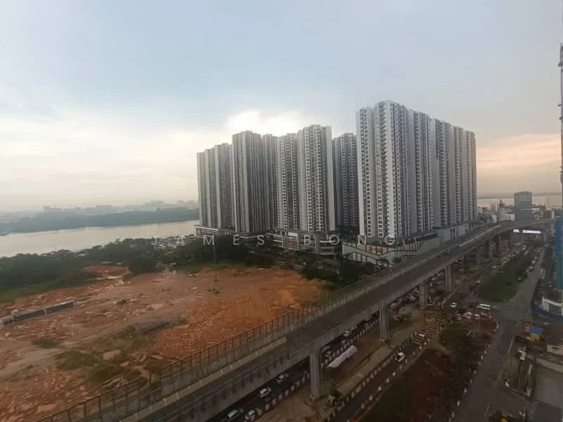 Exterior type: high-rise condominium; features: multiple high-rise buildings, glass curtain wall, surrounding construction site, river view in background, urban landscape, road infrastructure visible, greenery at base of buildings; style: modern.