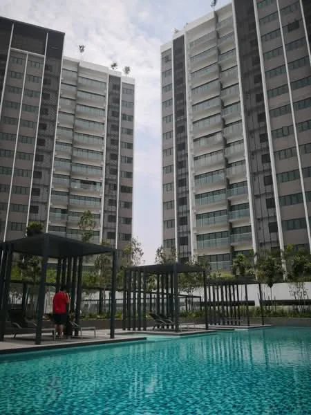 Exterior type: high-rise condominium; features: two tall residential towers, swimming pool with mosaic tile, pool deck with loungers, landscaped garden area, manicured greenery, modern architectural design, balconies on each unit, outdoor seating areas with pergolas; style: modern.