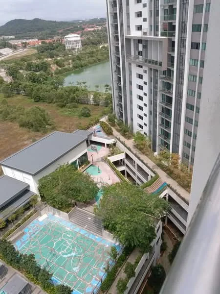 Exterior type: high-rise condominium; features: swimming pool, landscaped garden, children's playground, pool deck with loungers, manicured lawn, multi-storey car park, surrounded by greenery, view of nearby lake, modern architectural design, balconies on upper floors; style: modern.
