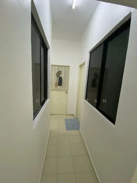Hallway features: white painted walls, tile flooring, two large windows, ceiling light fixture, decorative artwork on wall, door leading to another room, neutral color scheme, mat at entrance; style: modern.
