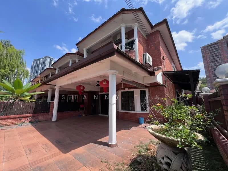 Exterior type: detached bungalow; features: red brick facade, white columns, flat roof, manicured lawn, paved outdoor area, outdoor lanterns, surrounded by greenery, visible air conditioning units, decorative planter, large windows, covered porch; style: traditional.