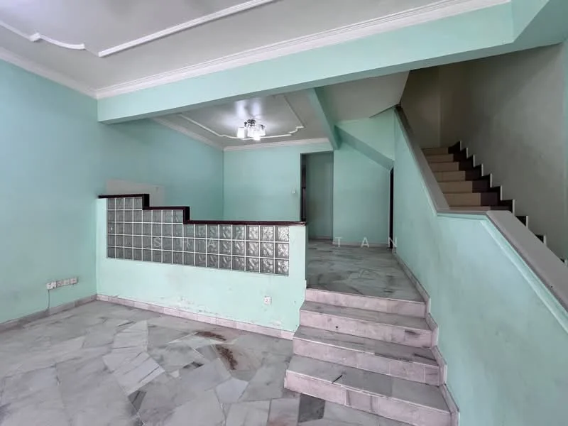 Room features: light green painted walls, marble flooring, staircase with marble steps, glass block partition, tray ceiling, ceiling light fixture, open layout, corner wall with no visible features; style: modern.