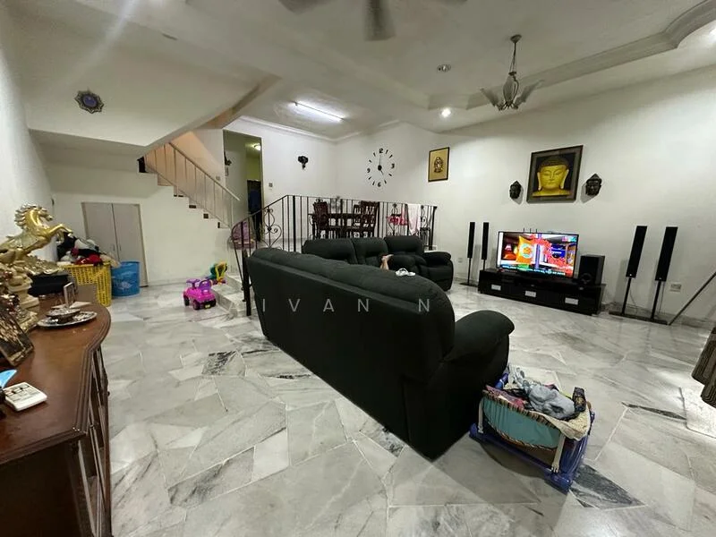 Living features: marble flooring, white painted walls, ceiling fan, wall-mounted TV, black TV console, 2-seater fabric sofa in dark green, 3-seater fabric sofa in dark green, decorative wall clock, decorative artwork, staircase in background, open space layout; style: contemporary.