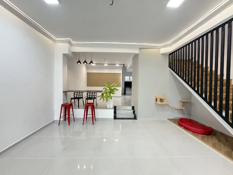 Living features: white painted walls, grey tiled flooring, recessed downlights, staircase with wooden steps and black railing, open layout, decorative plant, 2 red bar stools, bar counter with 4 black chairs, cat tree, red pet bed; style: modern.