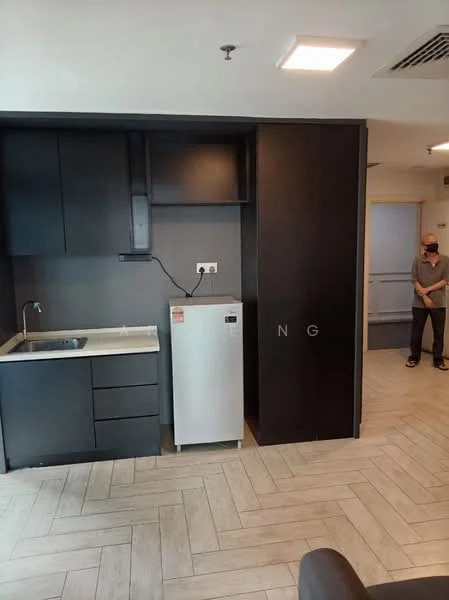 Kitchen features: single-bowl stainless-steel sink, chrome pull-down faucet, white countertop, black cabinetry, built-in oven, fridge, grey herringbone tile flooring, wall-mounted extractor hood; style: modern. Room features: light fixture in ceiling, open layout, doorway leading to hallway.