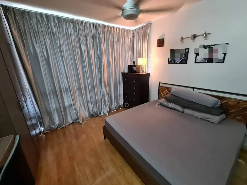 Bedroom features: queen-size bed with grey bedding, wooden bed frame, 5-blade ceiling fan with light, laminate flooring, floor-to-ceiling curtains in light grey, black dresser, nightstand with lamp, framed artwork on walls; style: modern.