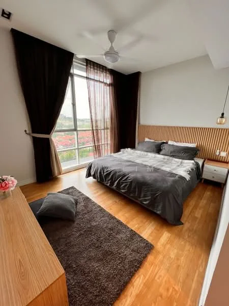 Bedroom features: king-size bed with grey bedding, wooden headboard, 2 bedside tables, pendant light, 5-blade ceiling fan, floor-to-ceiling windows, sheer curtains, dark brown curtains, wooden flooring, area rug with geometric pattern, decorative throw pillow, view of greenery outside; style: modern; view: garden.