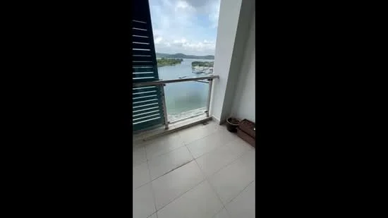 Balcony features: sliding glass door, glass railing, tile flooring, outdoor view of water, outdoor view of boats, overhead shade, wooden storage box; view: water.