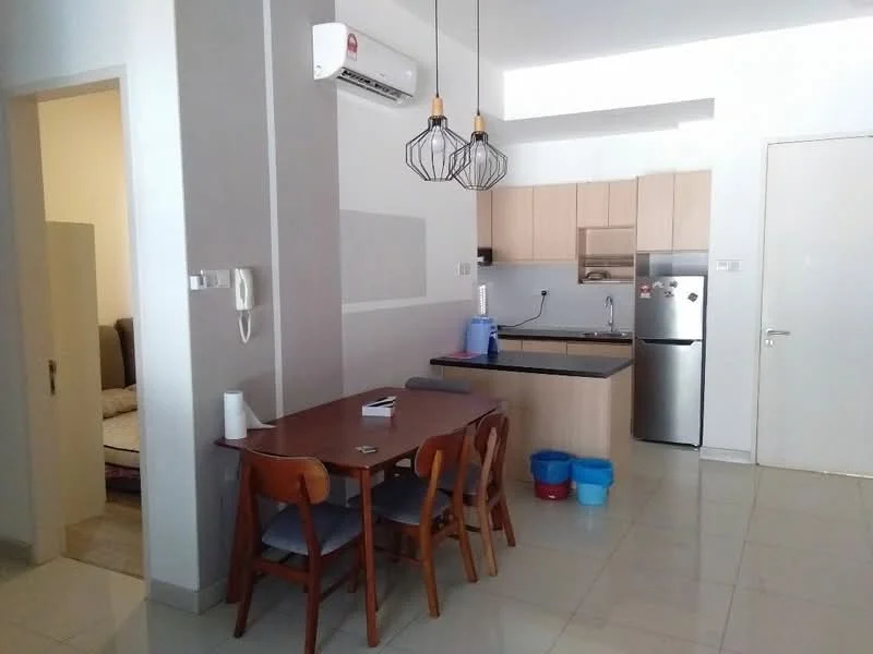 Kitchen features: white painted walls, grey tiled flooring, ceiling with recessed lighting, kitchen island with black countertop, stainless-steel fridge, built-in oven, 4-burner gas hob, single-bowl stainless-steel sink, chrome pull-down faucet, wood cabinetry, pendant lighting above dining table, wall-mounted split AC; style: modern. Dining features: wood dining table, 4 wooden dining chairs, decorative wall panel, open layout to kitchen; style: modern.