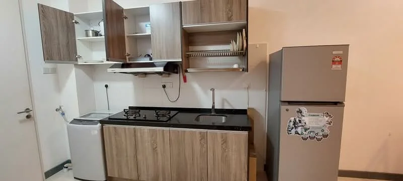Kitchen features: laminate cabinetry in wood finish, black granite countertop, double-burner gas hob, stainless-steel sink, chrome pull-down faucet, built-in wall shelves, refrigerator, washing machine, white walls, tile flooring; style: modern.