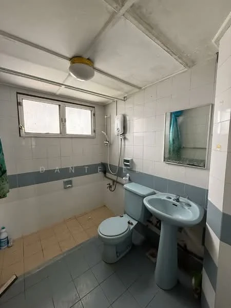 Bathroom features: white tiled walls, light blue tiled accents, cream ceramic floor tiles, toilet, sink with pedestal, mirror, shower with wall-mounted showerhead, water heater, window for natural light, ceiling light fixture.