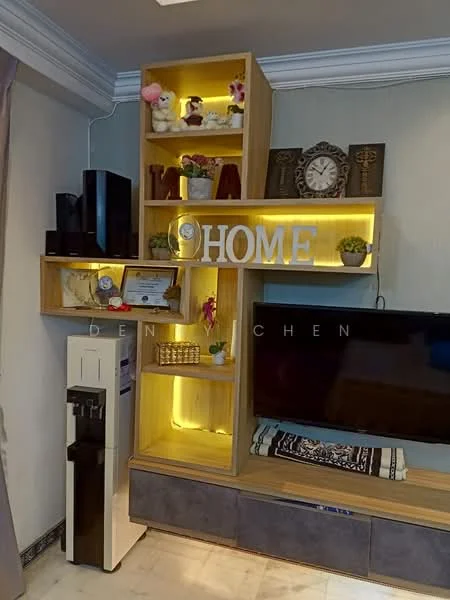 Living features: wooden shelving unit with backlighting, decorative items including plush toys and plants, wall-mounted TV, TV console with storage, water dispenser, clock on the shelf, framed certificate, decorative letters spelling 'HOME', neutral wall color, white ceiling with crown moulding, marble flooring; style: modern.