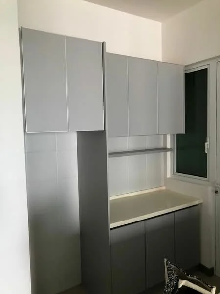 Room features: grey cabinetry, upper cabinets with flat-panel design, lower cabinets with flat-panel design, white countertop, white tiled backsplash, window with sliding mechanism, neutral wall colour, flooring not visible; style: modern.