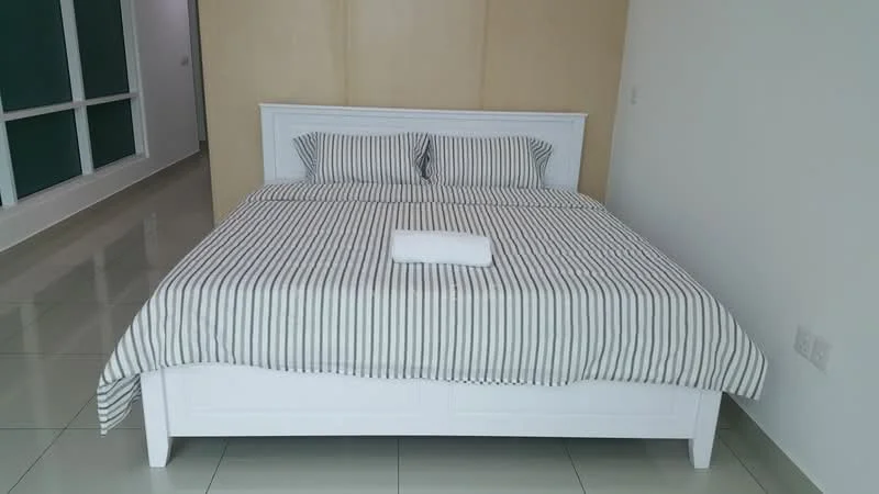 Bedroom features: king-size bed with white frame, striped bedding in grey and white, two matching pillows, white wall behind bed, glossy tile flooring, built-in wardrobe, large window with green view, neutral wall color; style: modern.