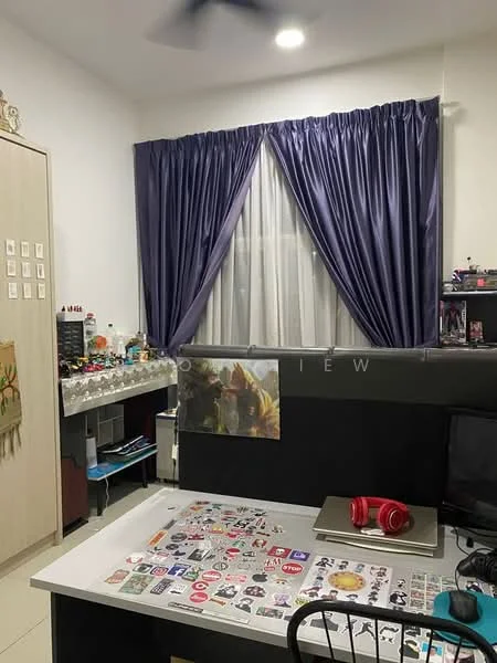 Room features: white painted walls, grey floor tiles, ceiling fan, large window with sheer curtains, dark grey desk, black office chair, decorative items on desk, purple curtains, shelves with various items, computer monitor, headphones on desk; style: modern.