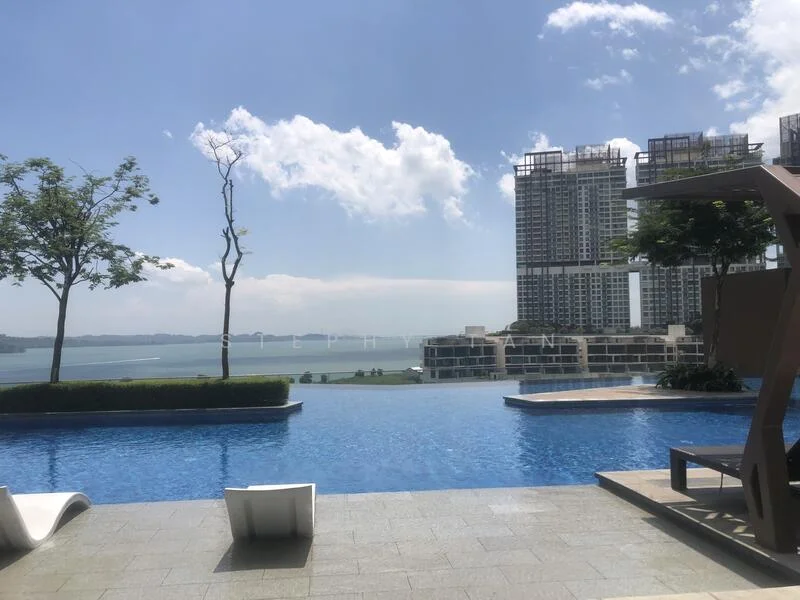 Exterior type: high-rise condominium; features: infinity pool, pool deck with loungers, landscaped garden, manicured lawn, view of the sea, surrounding trees, modern architecture, high-rise buildings in background; style: modern.