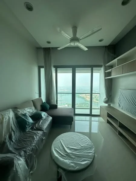 Living features: 3-seater fabric sofa in grey with plastic covering, round coffee table with white cover, floor-to-ceiling windows, curtains in light fabric, ceiling fan, wall-mounted TV console, shelves on wall, glossy tile flooring, view of the city skyline; style: modern; view: city.