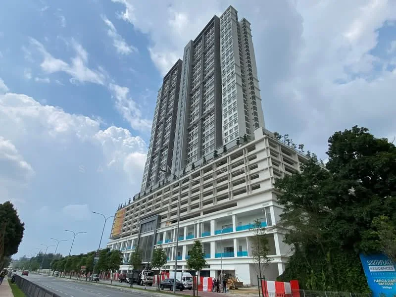 Exterior type: high-rise condominium; features: glass curtain wall, white painted facade, projecting balconies, multiple storeys, landscaped ground level, parking deck, signage on facade, surrounded by greenery; style: modern.