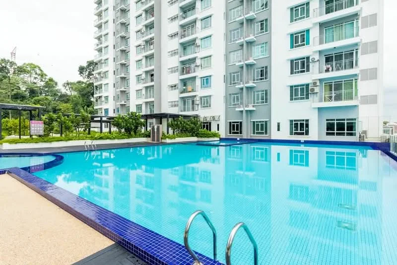 Exterior type: high-rise condominium; features: infinity pool, pool deck with loungers, landscaped garden, glass curtain wall, balconies with glass railings, manicured lawn, surrounded by greenery; style: modern.