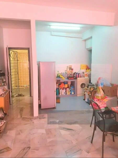 Kitchen features: marble tile flooring, white painted walls, single-bowl stainless-steel sink, built-in washing machine, refrigerator, various kitchen supplies and condiments, overhead fluorescent lighting, open layout to dining area. Dining features: round dining table, black dining chairs, various items on the table.