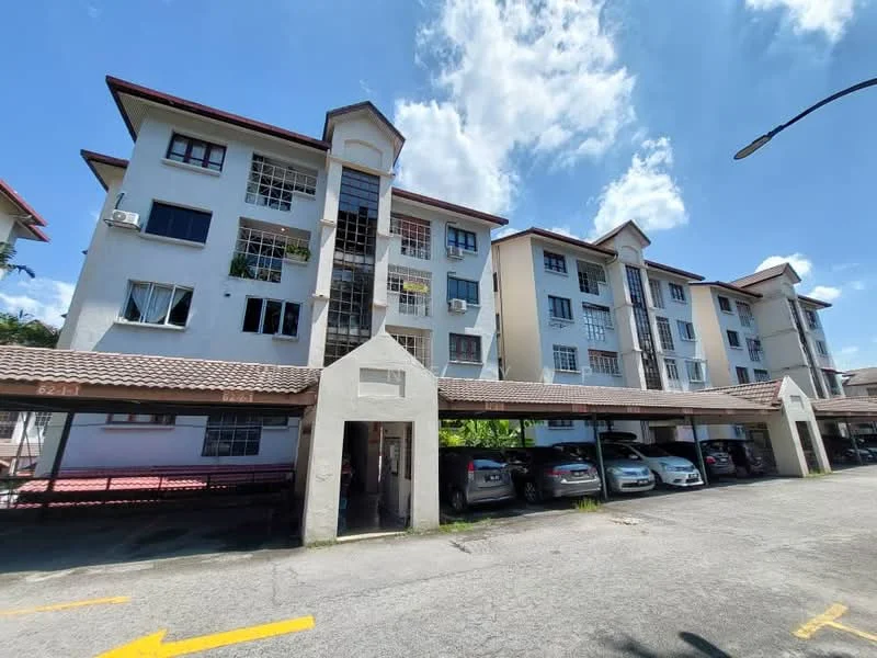 Exterior type: low-rise apartment block; features: white painted facade, flat roof, approximately 4-storey, covered parking area, multiple windows, balconies with railings, landscaped surroundings, driveway with marked parking spaces; style: modern.