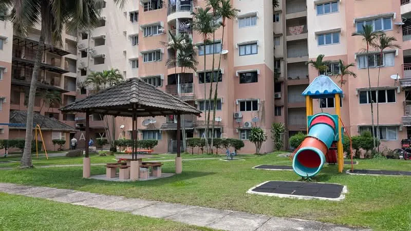 Exterior type: low-rise apartment block; features: playground with slide, playground with climbing structure, gazebo with seating, manicured lawn, paved walkway, surrounded by palm trees, multiple air conditioning units visible on facade, balconies on upper floors; style: modern.