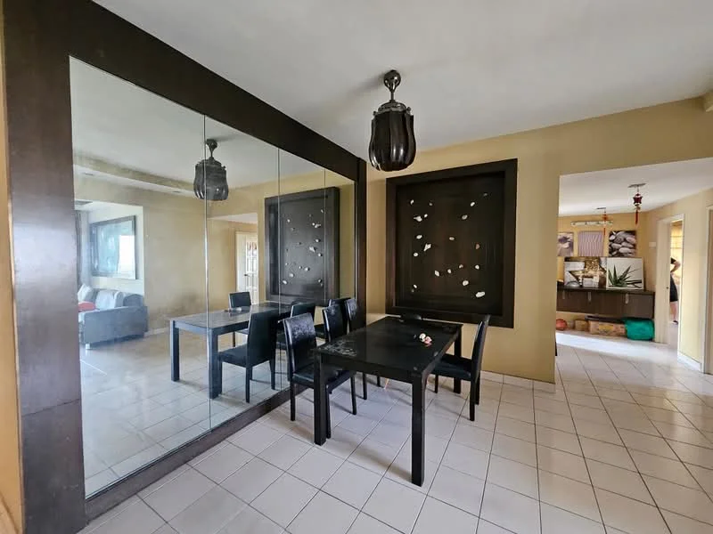 Dining features: black dining table, 4 black dining chairs, large wall mirror, decorative wall with abstract design, pendant light fixture, tile flooring, neutral wall color, open layout to adjacent living area; style: modern. Living features: sofa, coffee table, decorative items, natural light from window.
