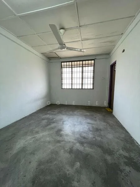 Room features: white painted walls, concrete flooring, ceiling fan, window with metal grille, door to adjacent room, no visible furnishings; style: minimalist.