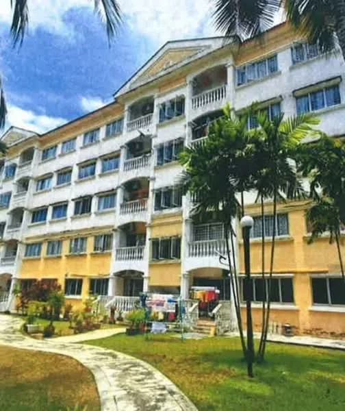 Exterior type: low-rise apartment block; features: white painted facade, yellow painted facade, balconies with railings, ground-level garden area, manicured lawn, palm trees, walkway, multiple windows, air conditioning units visible, laundry hanging on balcony; style: modern.