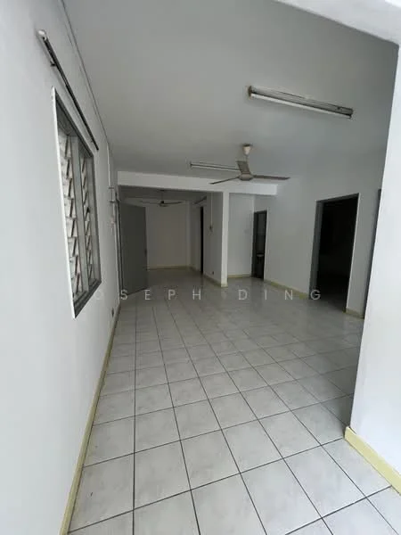 Room features: white painted walls, tile flooring, ceiling with fluorescent lights, 2-blade ceiling fan, window with metal grille, doorway leading to another room, corner with another doorway, light-colored skirting; style: minimalist.