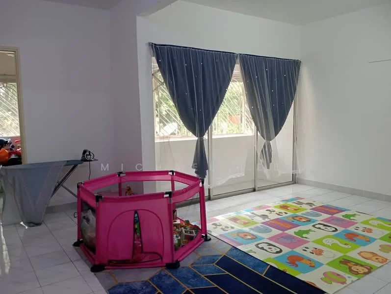 Living features: white painted walls, glossy tile flooring, floor-to-ceiling windows, sheer curtains, blue area rug with geometric pattern, colorful play mat, playpen, ironing board.