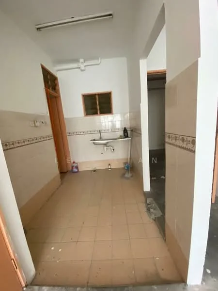 Room features: white painted walls, cream tiled flooring, single-bowl sink, wall-mounted faucet, window with wooden frame, light fixture on ceiling, cleaning supplies on floor.