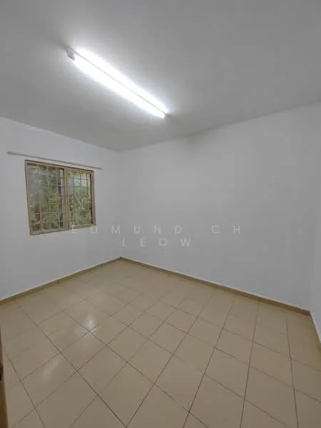 Room features: white painted walls, tile flooring, single window with metal grille, fluorescent ceiling lights.