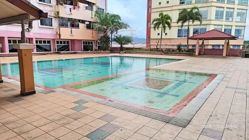 Exterior type: swimming pool deck; features: rectangular swimming pool, pool deck with tiled flooring, surrounding palm trees, covered gazebo, manicured landscaping, residential building in background, multiple levels of pool deck, pool tiles with decorative patterns; style: modern.