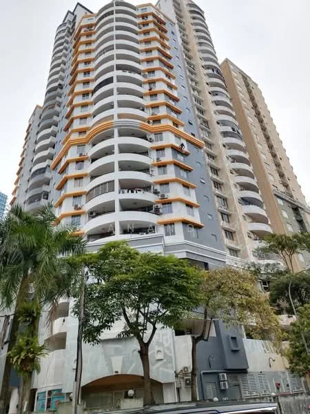 Exterior type: high-rise condominium; features: grey painted facade, orange accent features, recessed balconies, glass railings on balconies, multiple storeys, landscaped greenery at base, visible parking area, modern architectural design; style: modern.