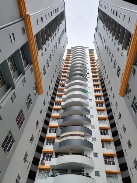 Exterior type: high-rise condominium; features: grey painted facade, recessed balconies, curved balcony design, multiple storeys, large windows, orange accent trim, vertical fins, glass railings; style: modern.