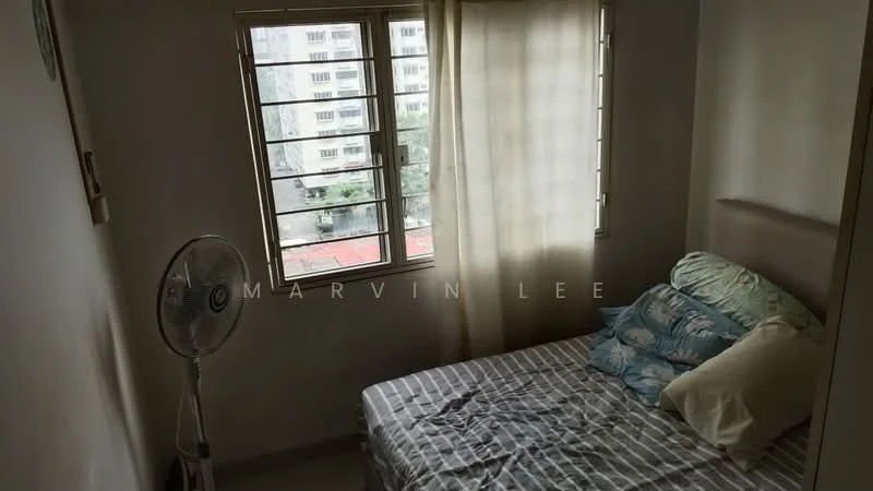 Bedroom features: single bed with floral bedding, striped bed linens, wall-mounted fan, window with sheer curtains, light-colored walls, tile flooring, built-in wardrobe, decorative wall clock.