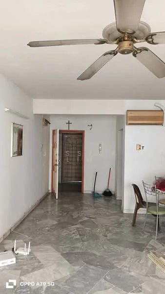 Room features: marble flooring, white painted walls, ceiling fan, wall-mounted air conditioning unit, mirror on wall, doorway leading to another room, cross on wall, broom and mop visible, dining table with chairs, open space layout; style: modern.