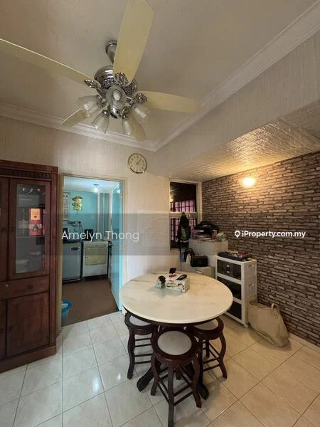 Dining features: round dining table, 4 wooden dining chairs, ceiling fan with light, wall clock, cream painted walls, exposed brick accent wall, tile flooring, built-in wooden cabinet; style: traditional. Kitchen features: open kitchen layout, white cabinetry, stainless-steel fridge, built-in oven, countertop, sink, kitchen appliances visible.