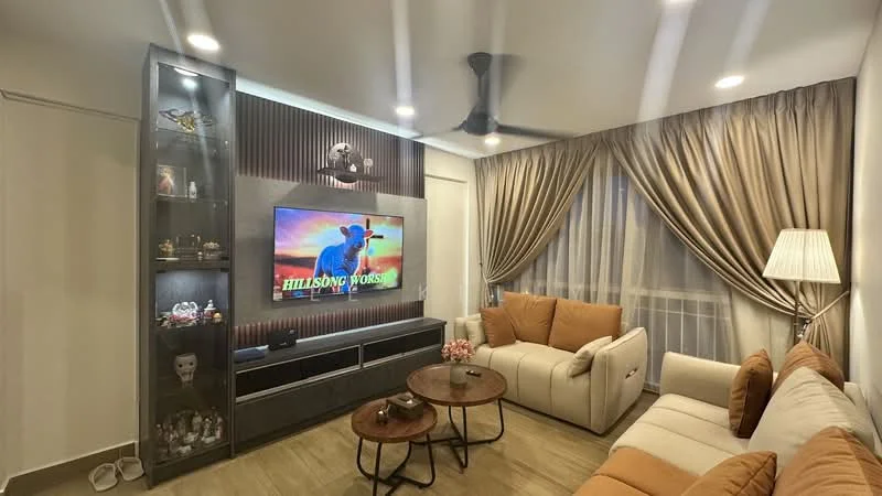 Living features: 3-seater fabric sofa in cream, 2-seater fabric sofa in orange, wooden coffee table with round top, TV console with built-in storage, wall-mounted TV, decorative shelving unit, floor lamp, curtains with sheer and blackout layers, ceiling fan with light, wooden flooring, wall with wood paneling, decorative items on shelves, potted plant; style: modern.