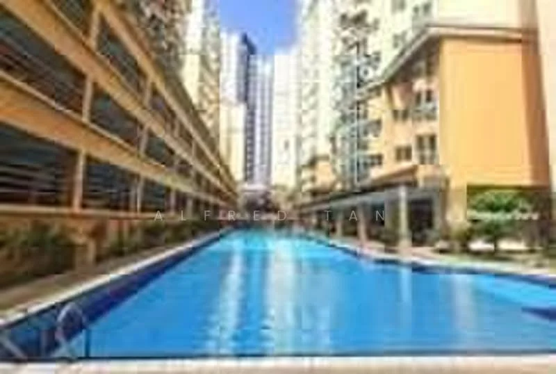 Exterior type: high-rise condominium; features: infinity pool, pool deck with loungers, surrounded by residential buildings, landscaped garden areas, glass curtain wall on buildings, multiple storeys, sunny outdoor area, paved walkway around the pool; style: modern.
