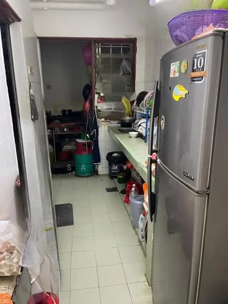 Kitchen features: stainless-steel fridge, green countertop, white tiled walls, light green tiled flooring, open shelving, kitchen cabinets, sink, cooking stove, various kitchen appliances, window, doorway leading to another room.